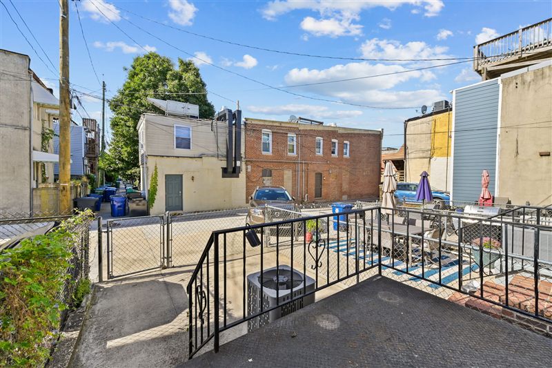 View from the back deck toward the alley and fenced patio