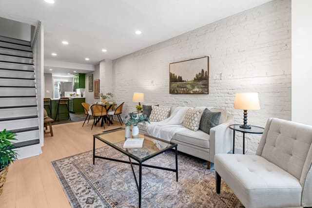 Living room and dining area in one long line with recessed lights