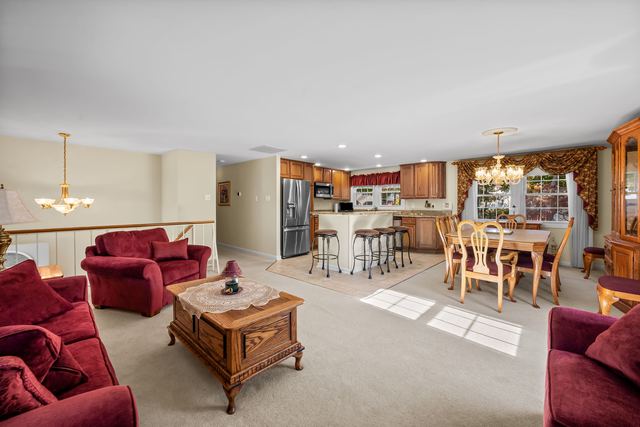 Open main level with the living room, dining table and kitchen island